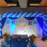 Blue and white balloon stage decoration for birthday party