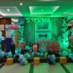 Boss Baby themed birthday stage decoration with blue balloon setup