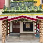 Traditional coconut pillar pandal decoration for housewarming entrance