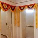 Orange and yellow marigold garland indoor decoration
