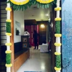 Yellow and white flower toran decoration for house entrance