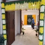 Yellow and white flower decoration with hanging bells for housewarming
